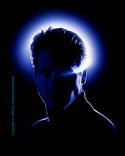 A blue-lit silhouette of Val Kilmer in The Saint key art
